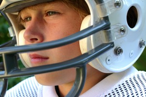 child in football helmet