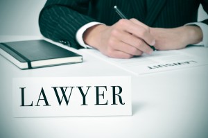 a man in his desk with a nameplate in front of him with the word